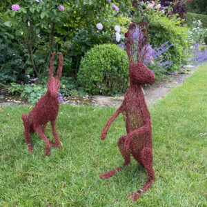 Melissa Orrom Swan WOA: Two red hares. Weatherproof garden sculpture, freestanding. Approx life-size.