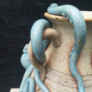 Abby Mason: Details of Octopus arm wrapping around a pot