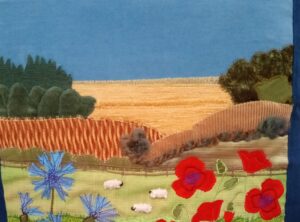 Lesley Russell Brown: Mixed fabric Collaged Cushion : Summer Countryside.