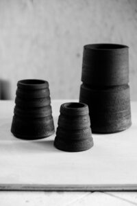 Ariadna Alvarez: Stoneware pieces at the leather-hard stage, freshly trimmed to refine form, balance, and surface before firing.