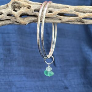 Alison Morris: Hammered sterling silver linked bangles with a sea glass dangle. Inner diameter 6.4 cm (medium). £78